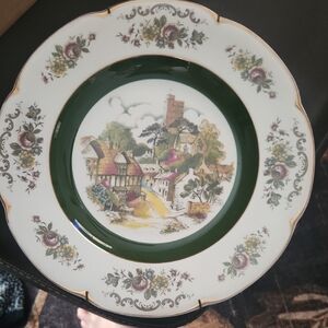 Charming Village Scene Dinner Plate with Green and White Floral Design